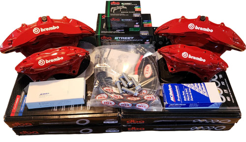 Brembo brake system components including red calipers and packaging on a white background